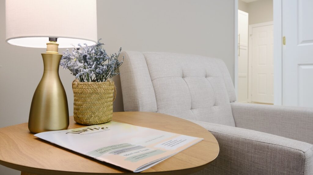 Foundations Family Therapy office with armchair, side table, plant and lamp