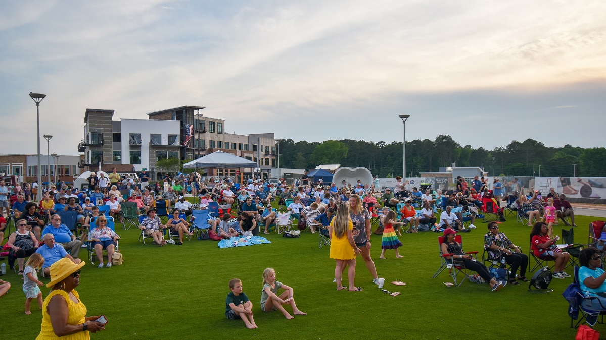 Visitors at MOSAIC listening to music from concert