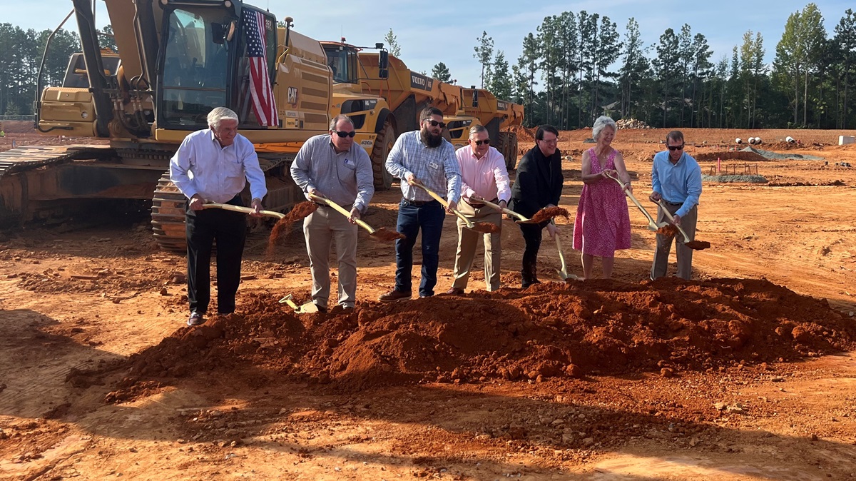 Seven Chatham County people with shovels at Medley at Northwood Landing groundbreaking in Pittsboro