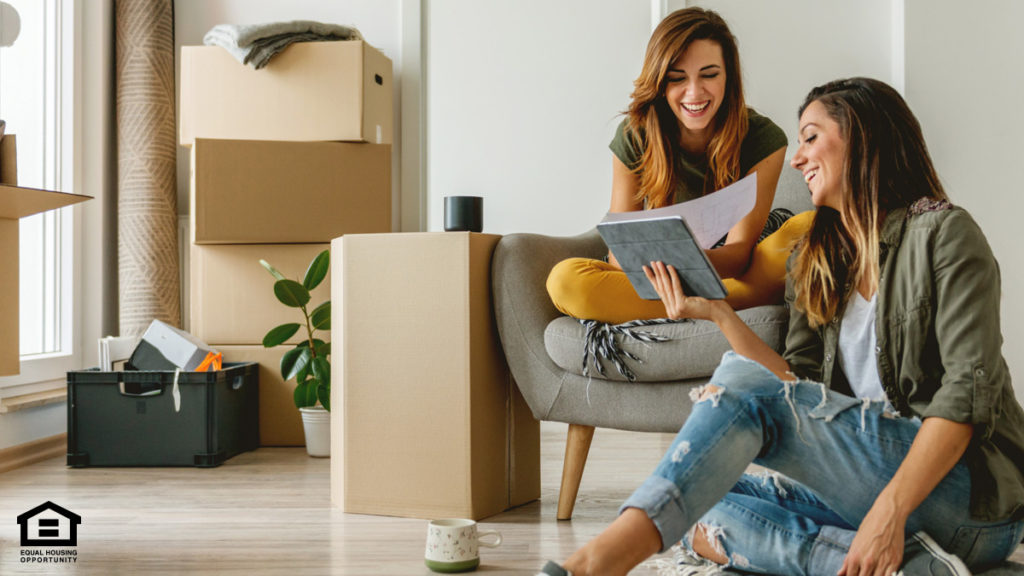 Mother and daughter moving into an apartment